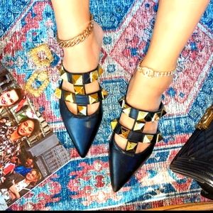 Black flat sandals with studded gold